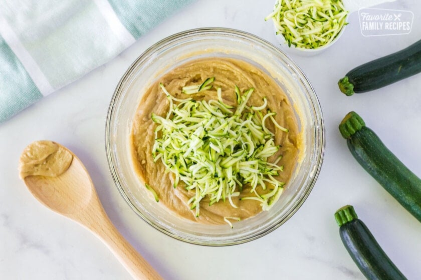 Zucchini added to bowl of Mom's Zucchini Bread batter.