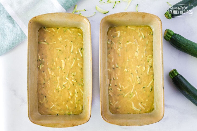Two loaf pans full of batter for Mom's Zucchini Bread.
