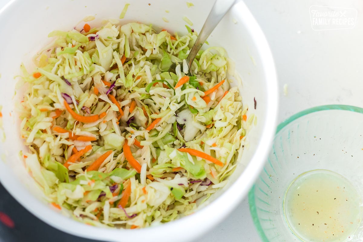 A bowl of slaw with tangy dressing