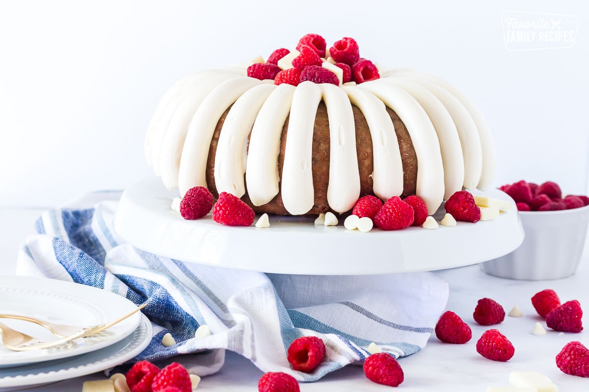 White Chocolate Raspberry Cake on a serving dish.