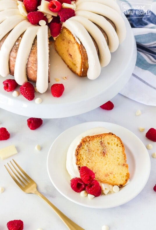 Slice of White Chocolate Raspberry Cake on a plate.