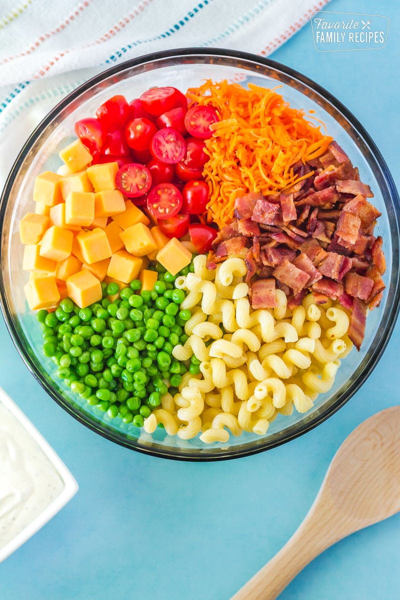 Ingredients in a colorful arrangement for Bacon Ranch Pasta Salad.