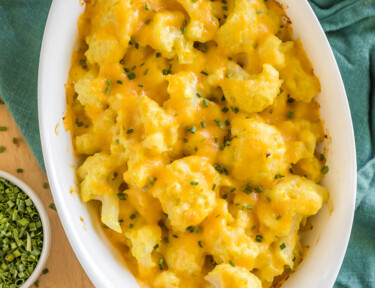 Cheesy Cauliflower side dish cooked in an oval baking dish