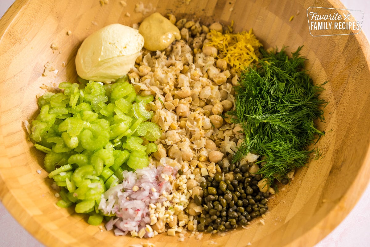 Ingredients for chickpea salad in a large bowl