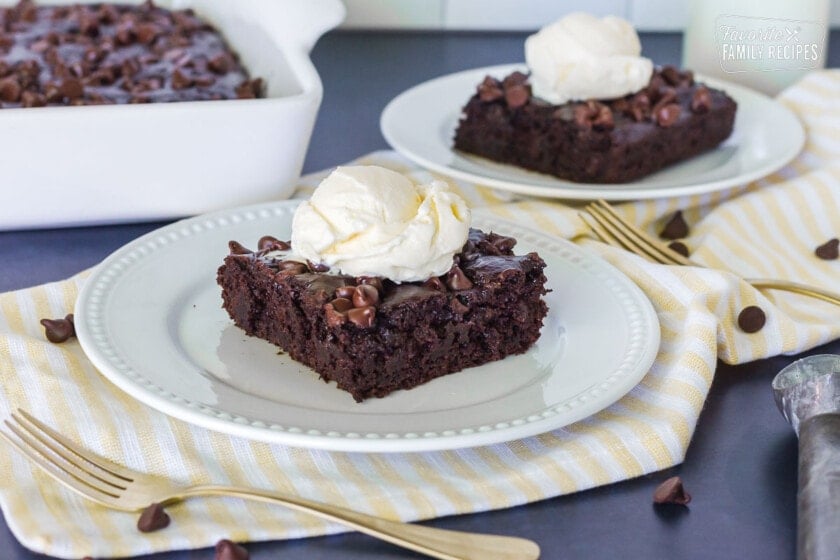 Two slices of Chocolate Pudding Cake topped with vanilla ice cream.