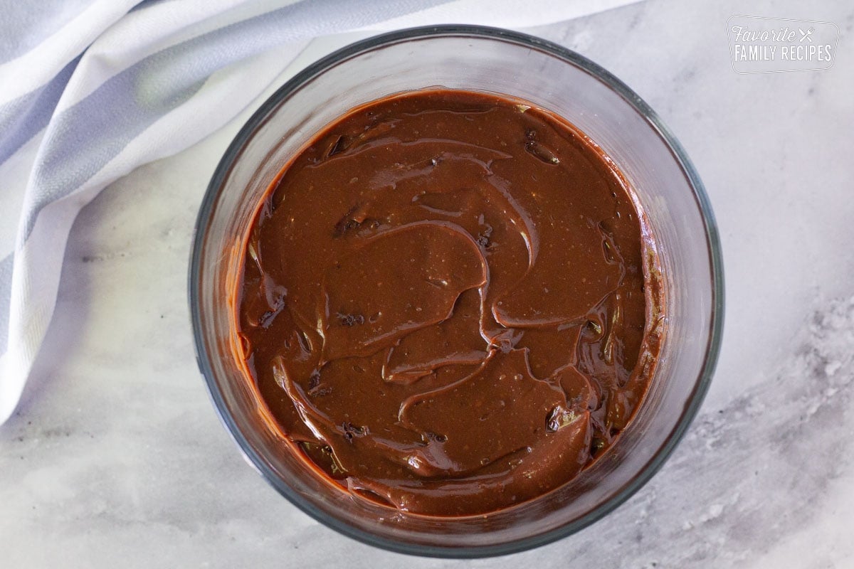 Chocolate pudding layer spread on top of the brownie layer in a glass trifle dish to make Chocolate Trifle.