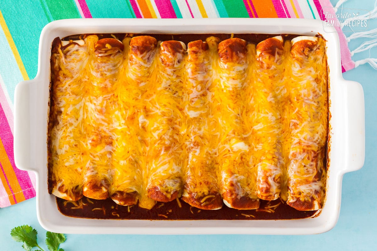 Baked Enchiladas with Homemade Enchilada Sauce in a dish.