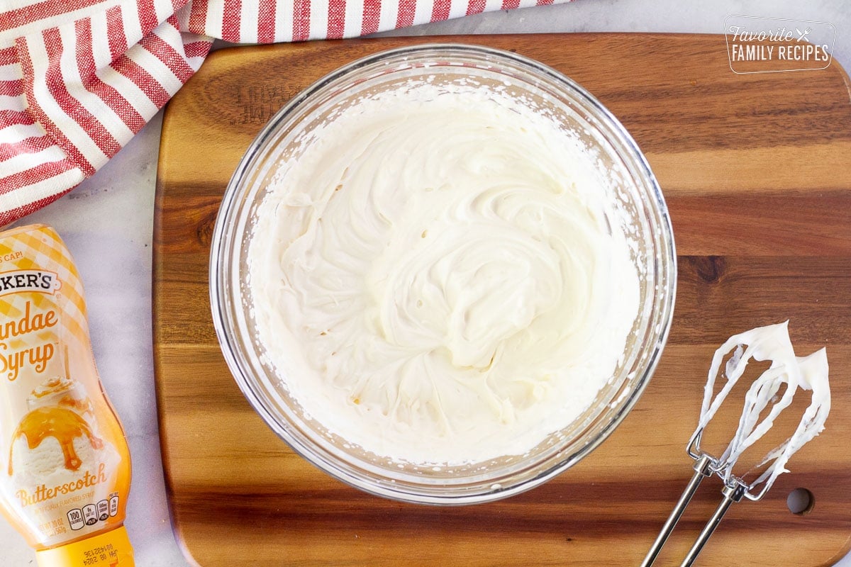 Butterscotch whipped topping in a bowl for Frozen Butterbeer.