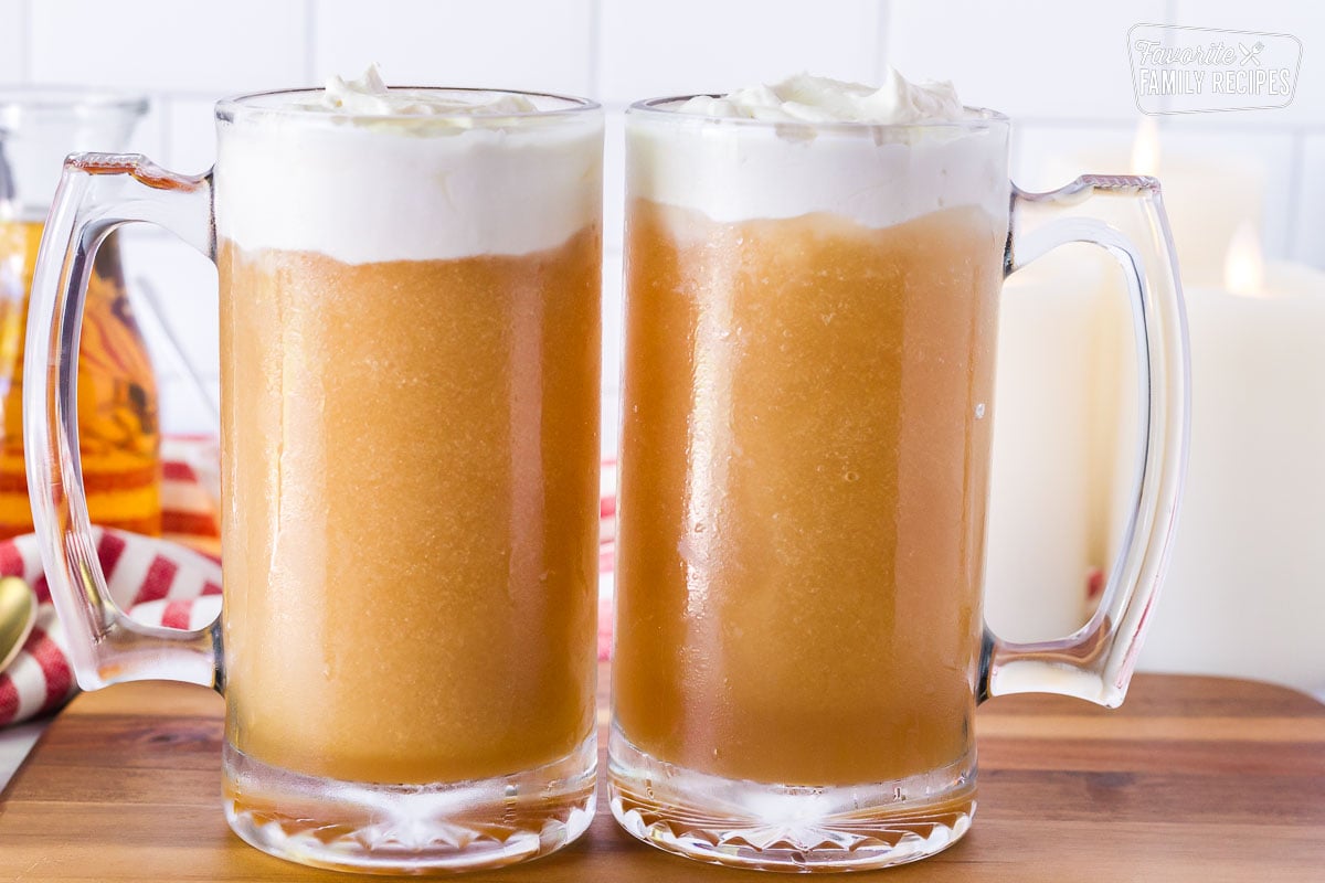 Two tall mugs of Frozen Butterbeer.