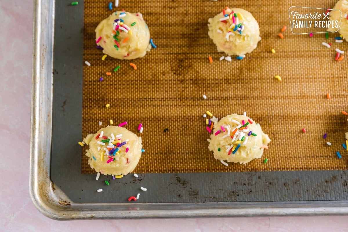 Cookie dough balls on a baking sheet