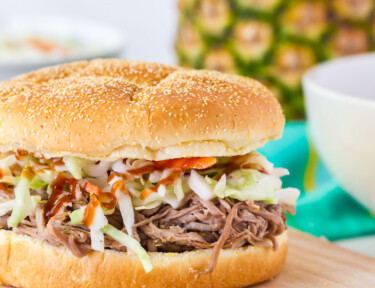 Kalua Pork Sandwich on a cutting board.