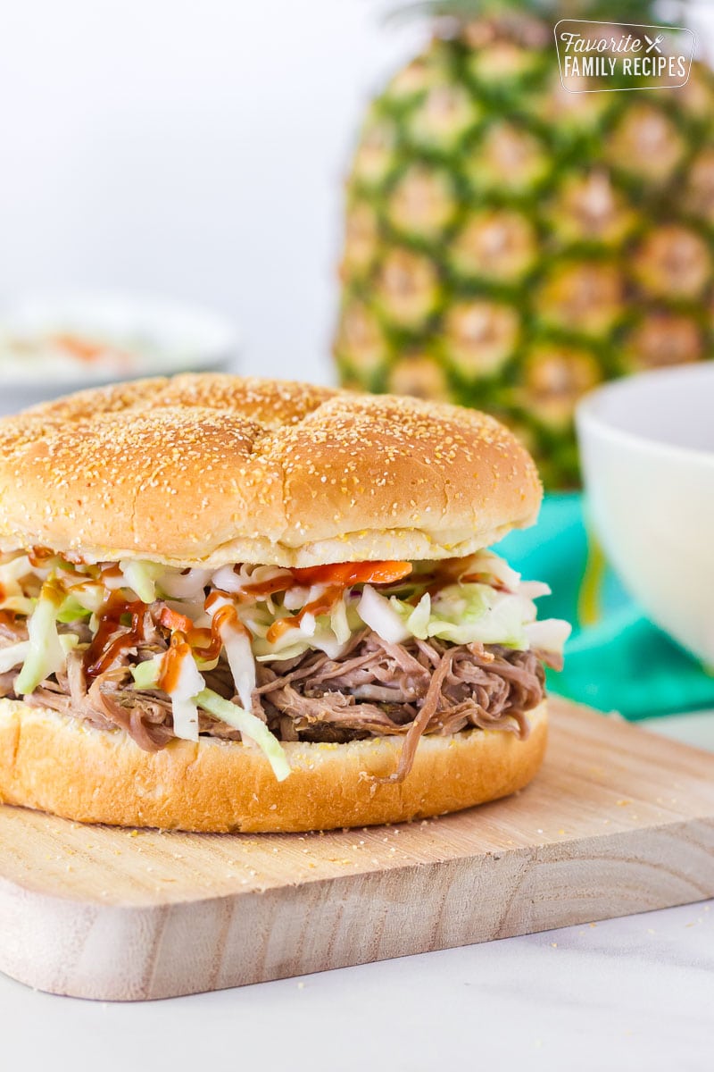 Kalua Pork Sandwich on a cutting board.