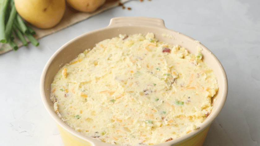 Mixed Loaded Mashed Potatoes in casserole dish