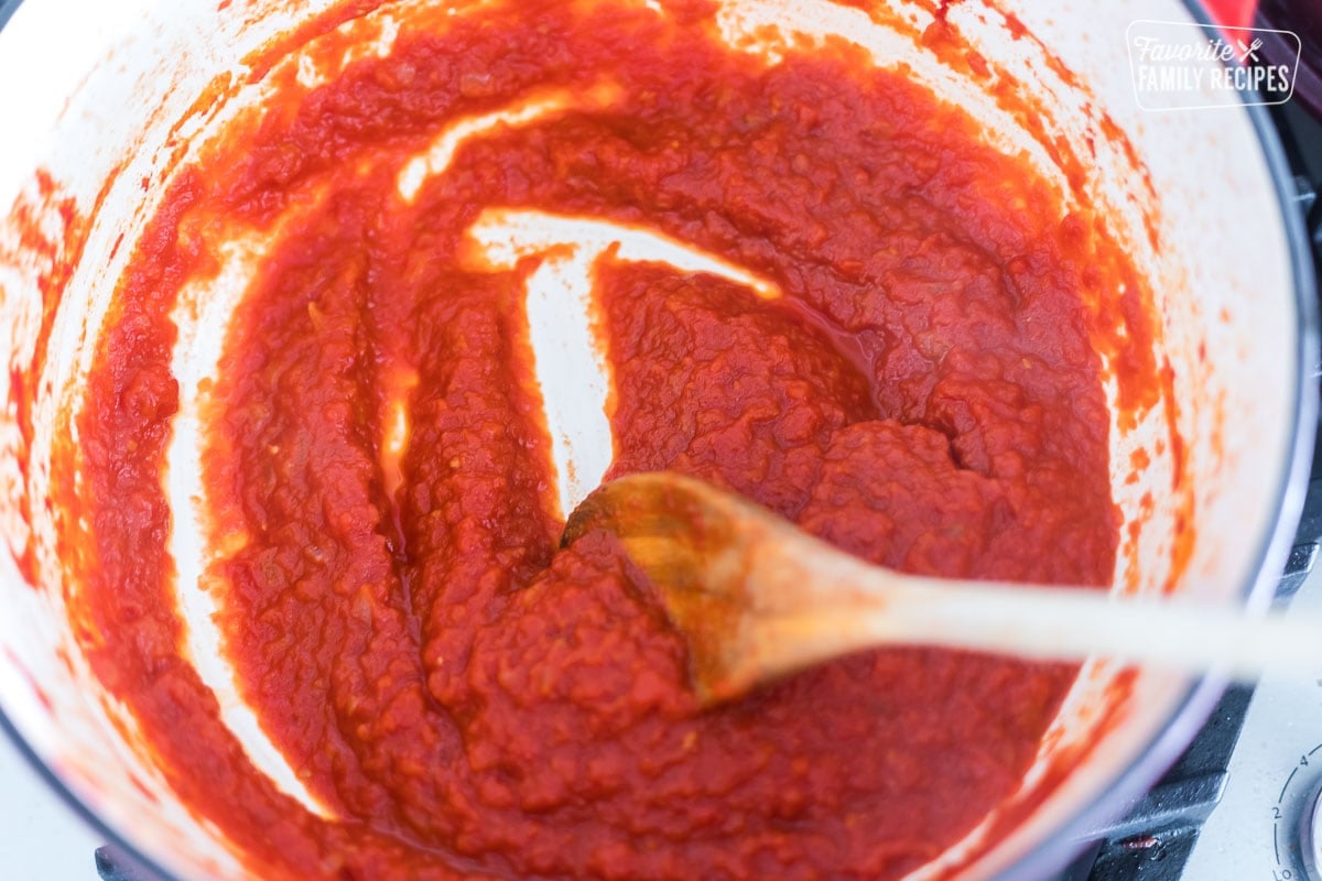 Tomatoes that have been reduced in a Dutch oven to make marinara dippings sauce