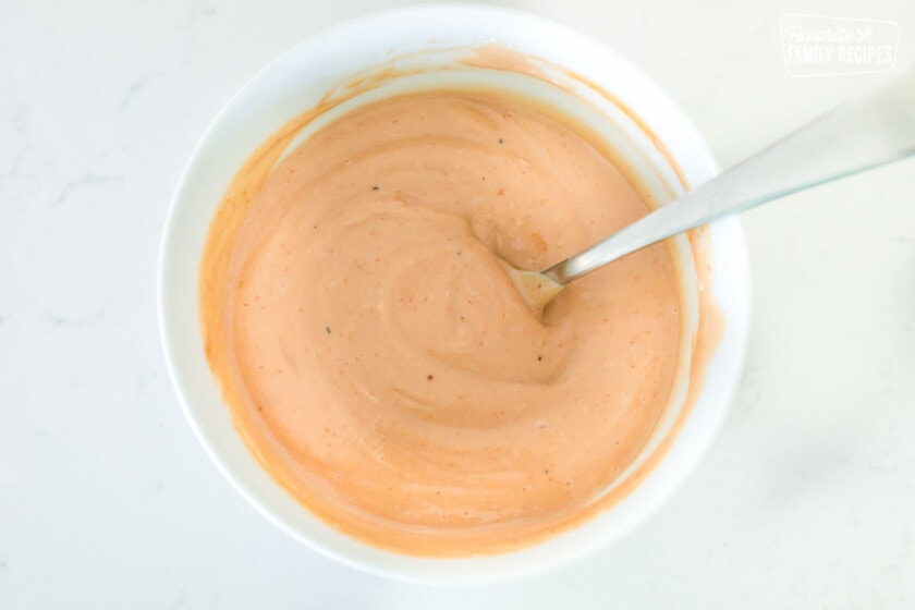A bowl of Red Robin campfire sauce with a spoon