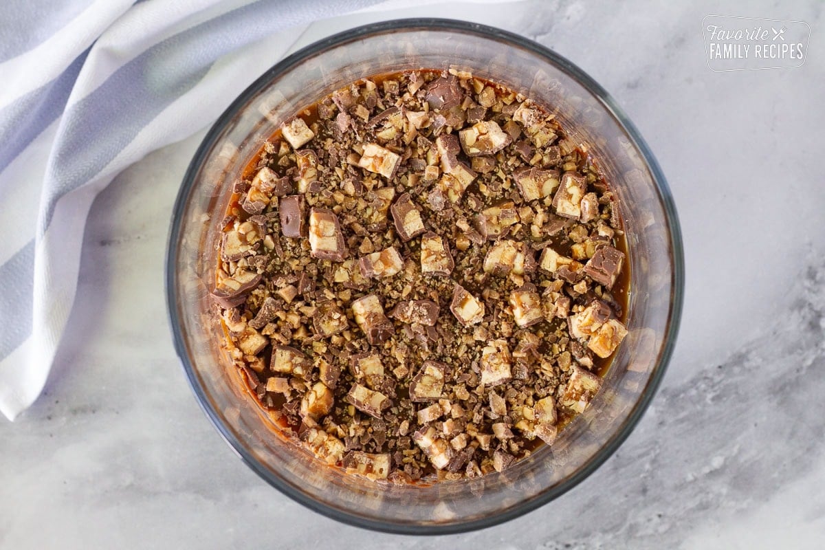 Cut up snickers and crushed heath bars layer in a glass trifle dish to make Chocolate Trifle.