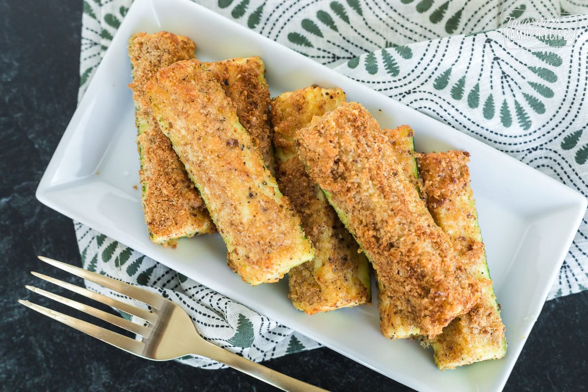 Air fried zucchini on a serving plate.