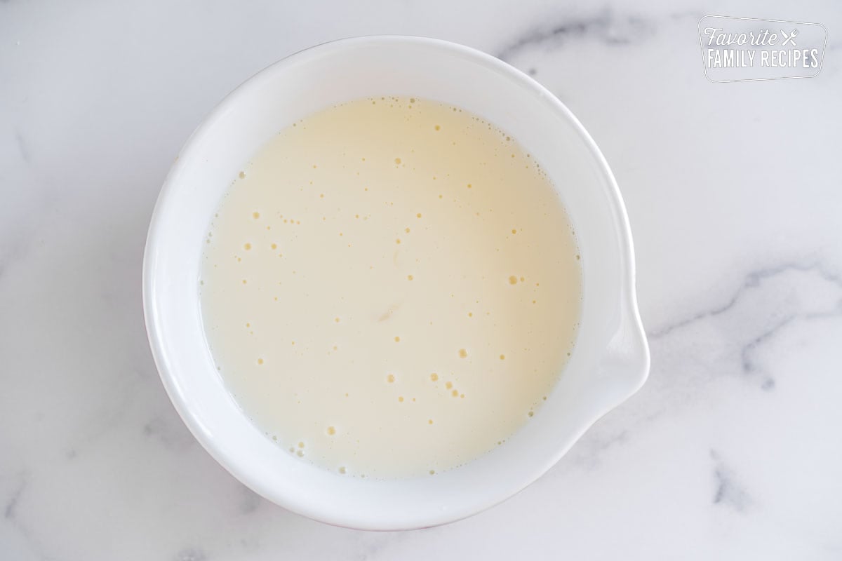 Wet pancake ingredients in a bowl