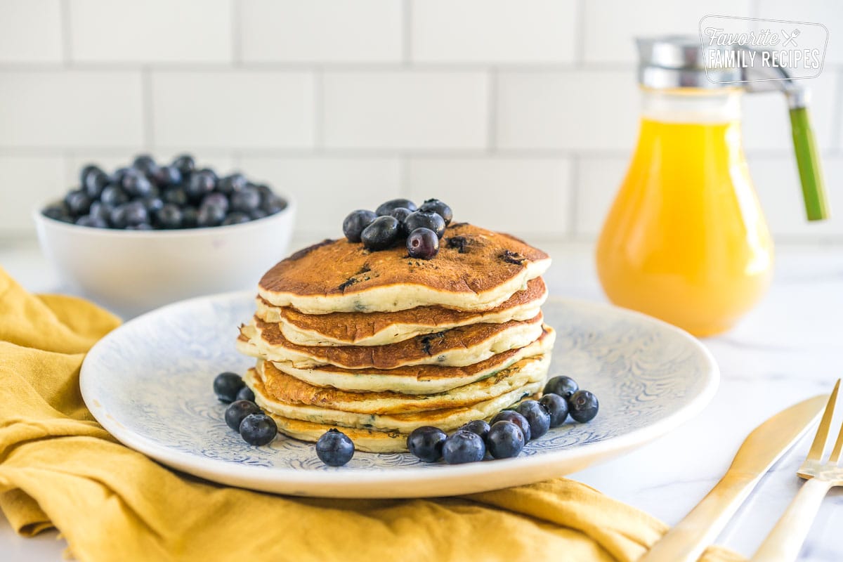 A stack of blueberry pancakes on a plate