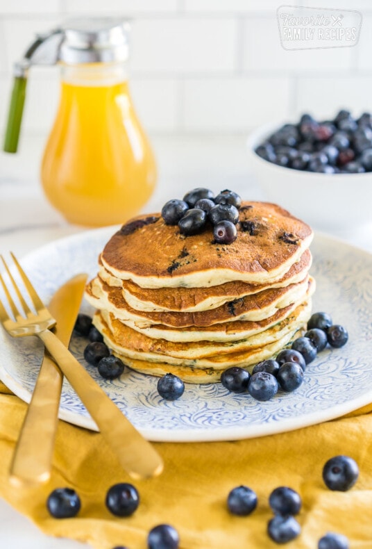 A stack of blueberry pancakes on a plate