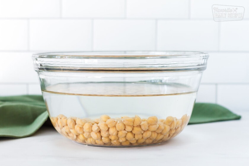 Chickpeas and water in a bowls for making Curried Chickpeas.