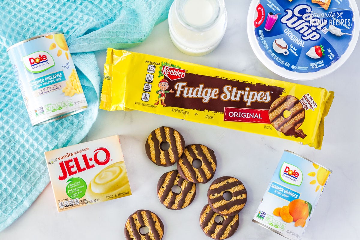 Fudge Stripes Cookies, Cool Whip, milk, can of mandarin oranges, vanilla Jello pudding mix, and a can of crushed pineapple to make Cookie Salad.