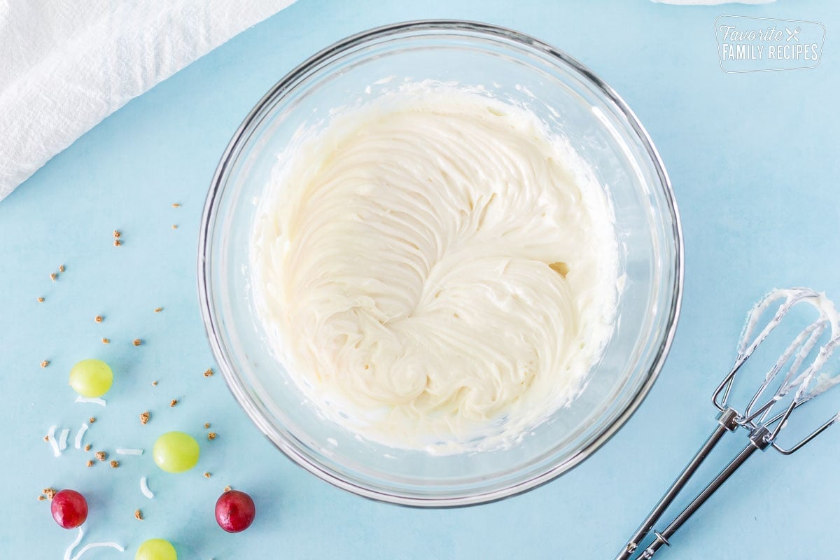 Bowl of cream cheese and sugar mixed to make Grape Salad.