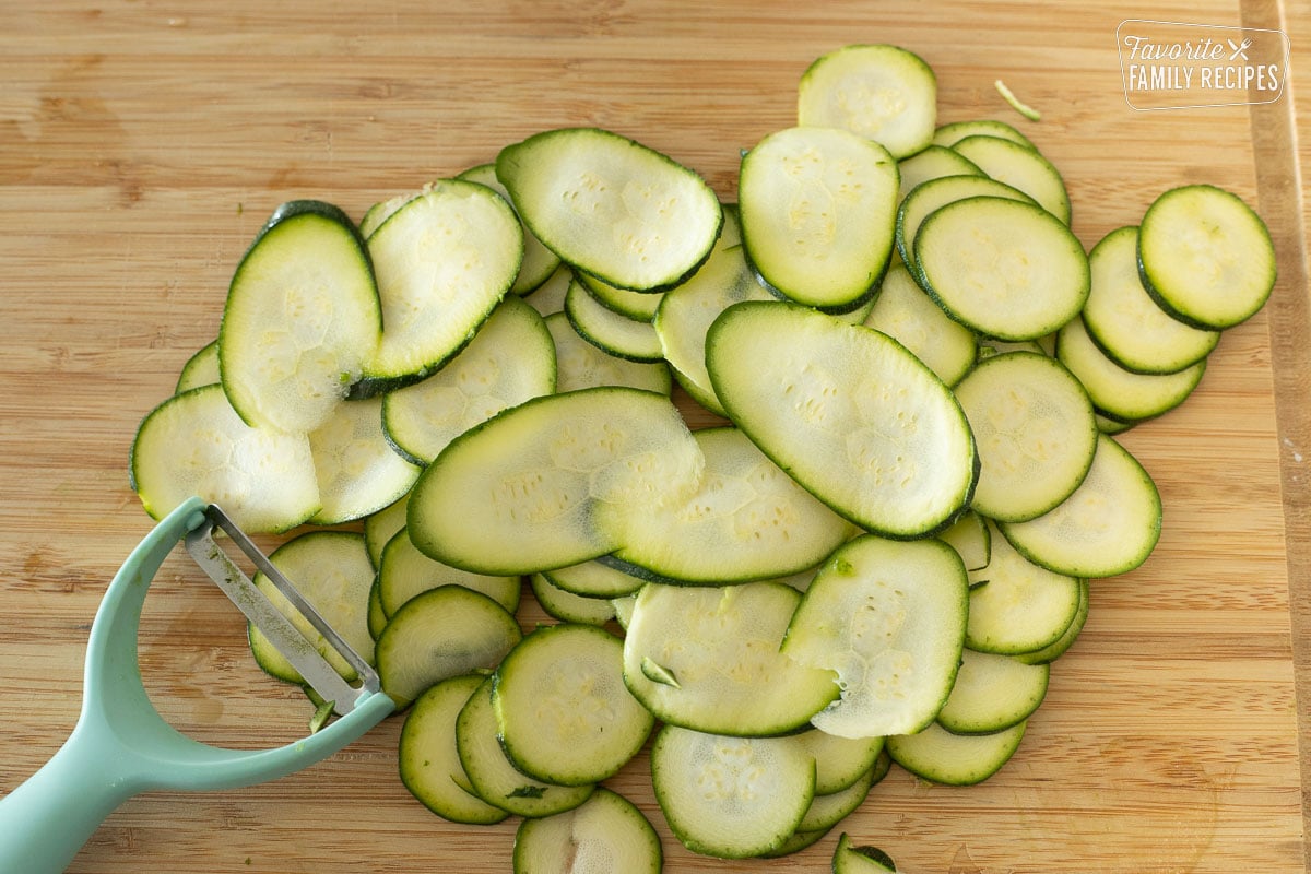Thin slices of zucchini that has been sliced with a vegetable peeler