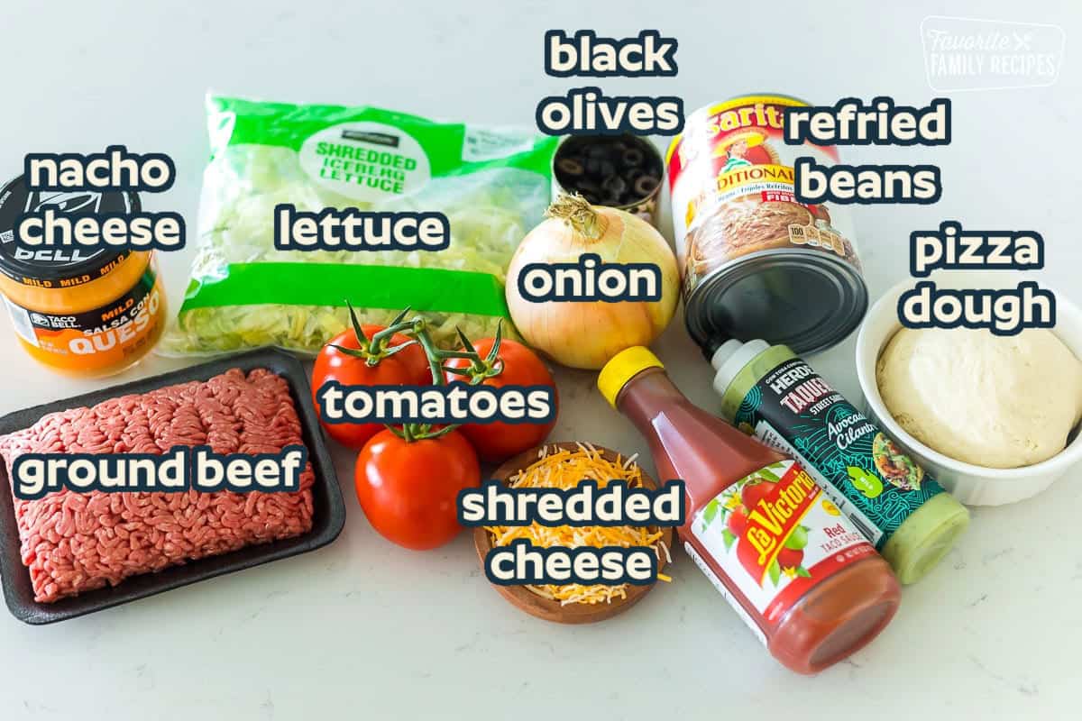 Ingredients to make taco pizza including ground beef, taco sauce, lettuce, and cheese