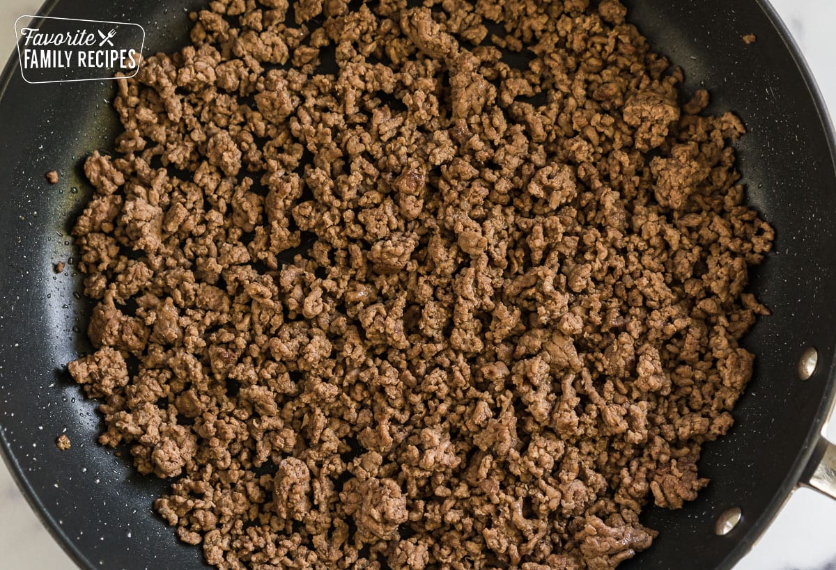 Ground beef in a skillet.