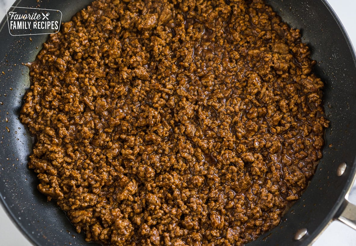 Ground beef in a skillet. 