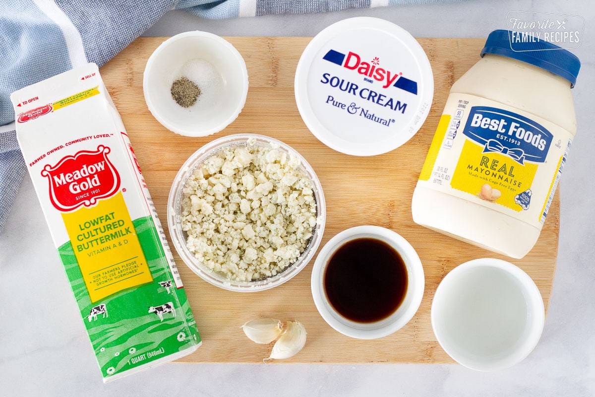 Cutting board with ingredients to make Blue Cheese Dressing.