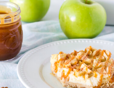 Layers of Salted Caramel Apple Cheesecake Bar on a plate.