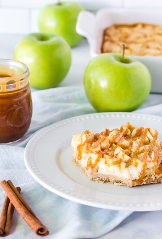 Layers of Salted Caramel Apple Cheesecake Bar on a plate.
