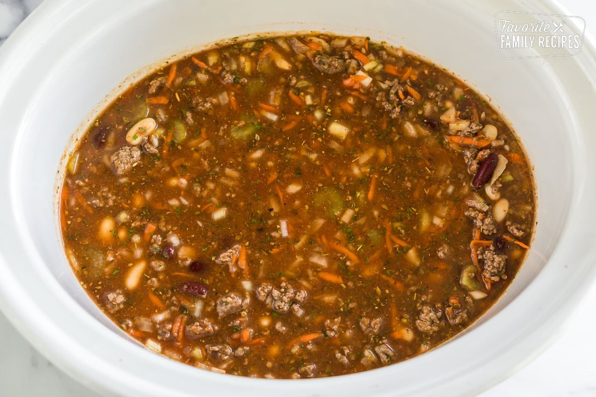 pasta e fagioli soup in a crock pot before it is cooked