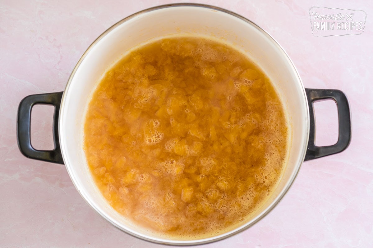 Peach syrup in a large pot