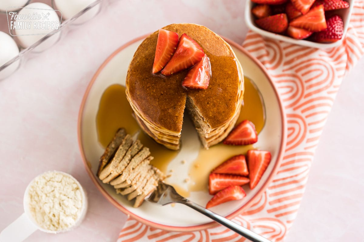 A stack of protein pancakes with a bite cut out.