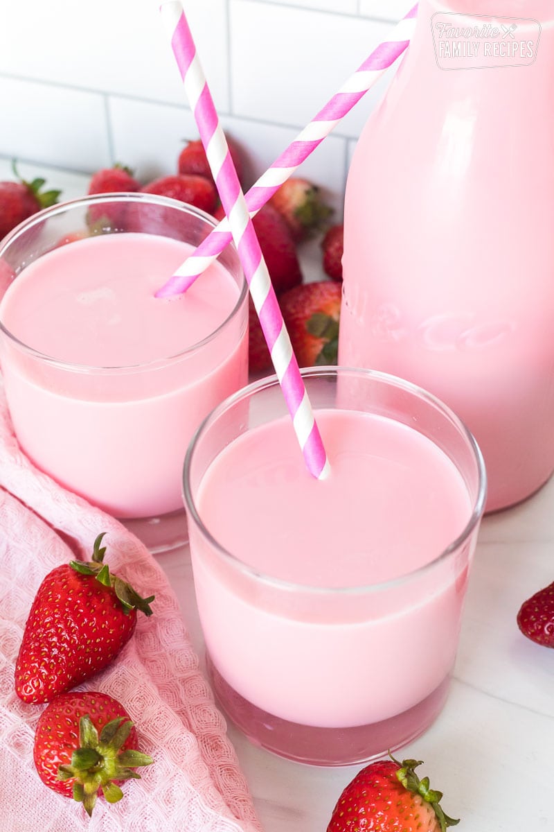 Stawyberry milk in clear glasses with straws