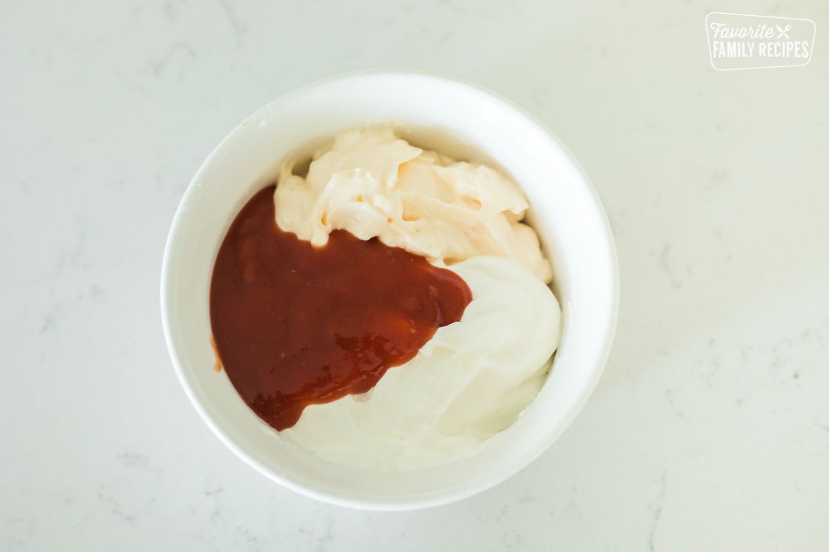 Taco sauce, mayonnaise, and sour cream in a bowl
