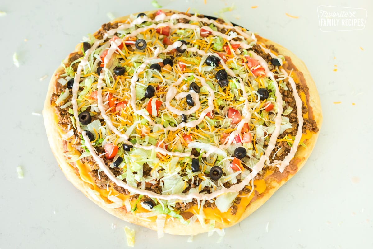 Completed taco pizza on counter top
