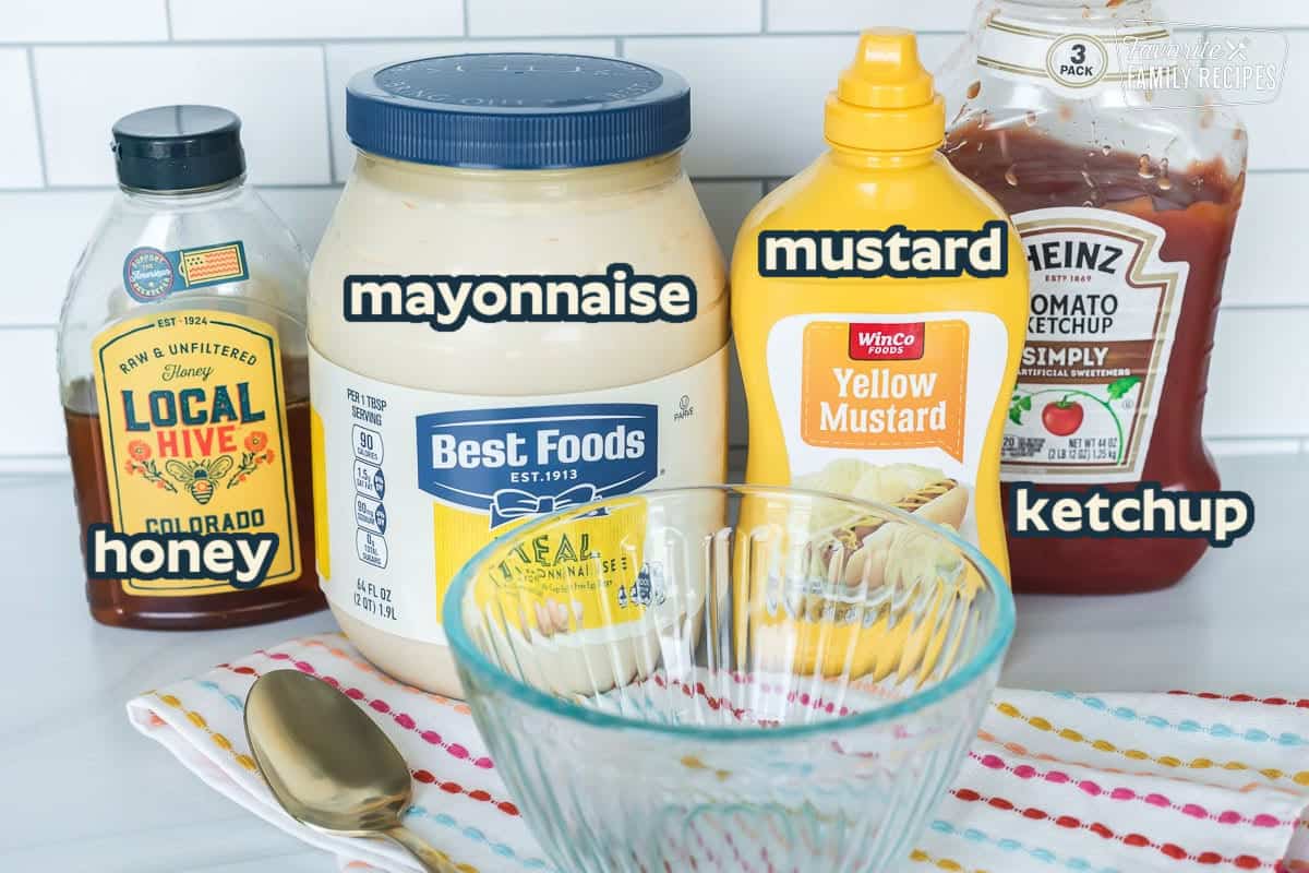 Ingredients to make Chick-Fil-A sauce including mayonnaise, mustard, ketchup, and honey