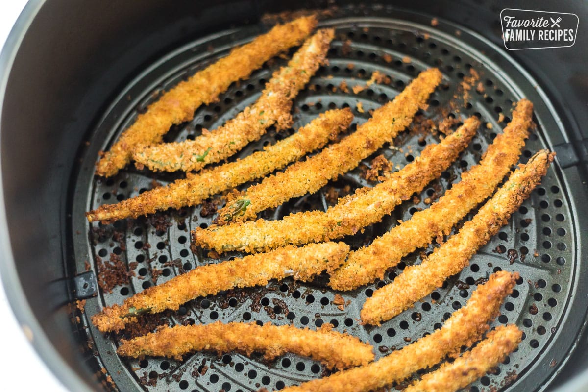 Breaded green beans in an air fryer.