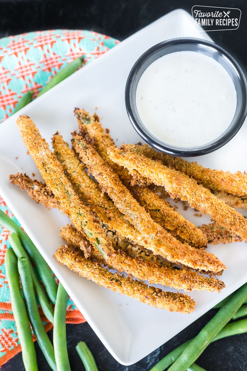 Fried air fryer green beans on a plate.