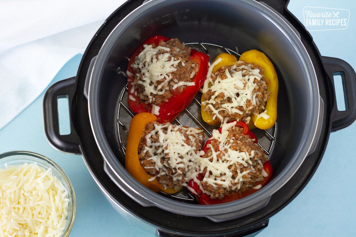 Cheese on top of cooked Instant Pot Stuffed Peppers.