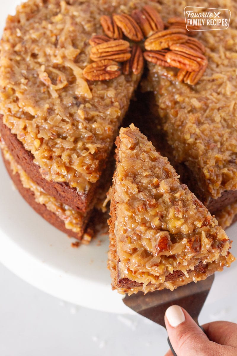 Slice of German chocolate cake with Coconut Pecan Frosting.