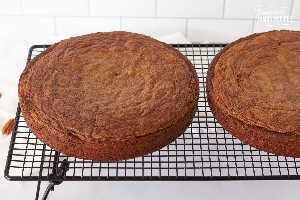 Two German Chocolate Cakes cooling on wire rack.