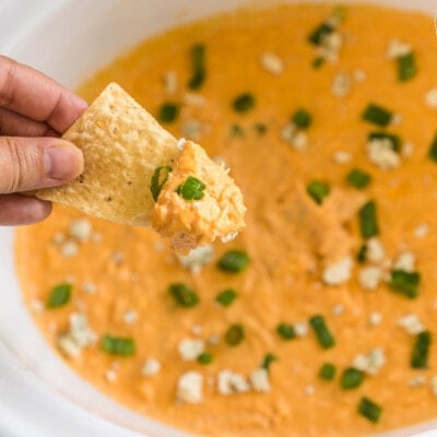 A chip dipped in buffalo chicken dip