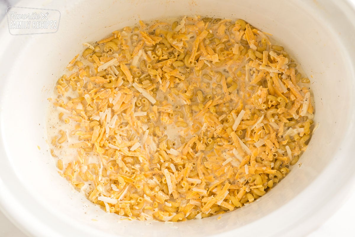 noodles, milk, and cheese in a crock pot