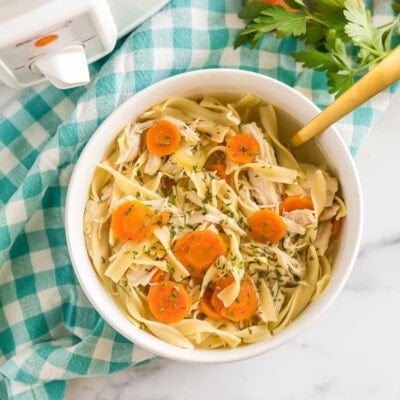 Chicken Noodle Soup that has been cooked in a crockpot