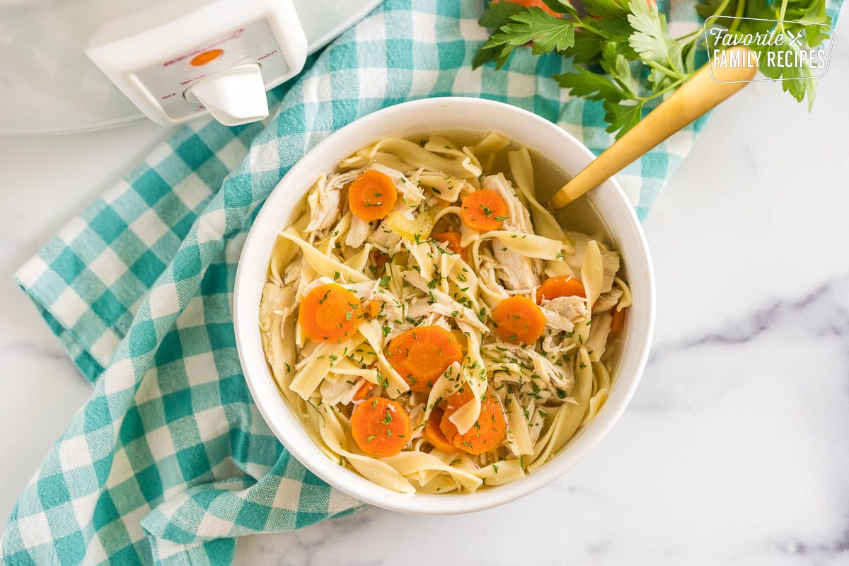 Chicken Noodle Soup that has been cooked in a crockpot.